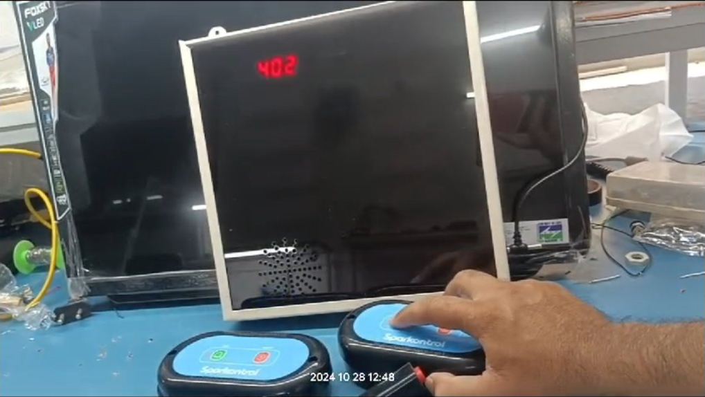 Technician testing a nurse call system during an AMC visit in Pune