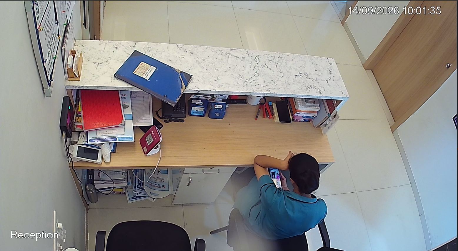 Hospital reception desk under CCTV coverage in Pune
