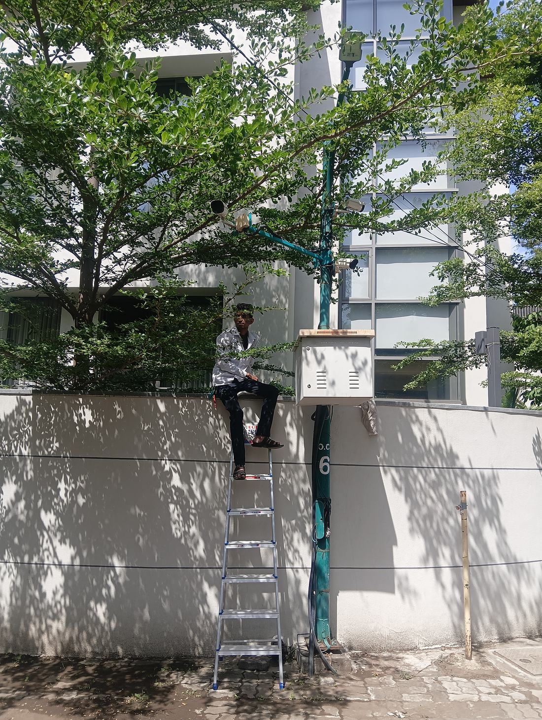 Prudent Security technician installing a CCTV camera on-site in Pune